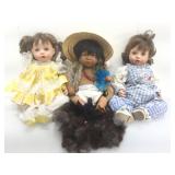 Assorted Porcelain dolls. With some accessories.