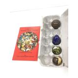 Round and egg shaped stone with marble collecting