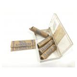 Rolled nickels in cigar box. Desert in stamp on