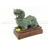 Dragon figure on wood stand. 5 in.