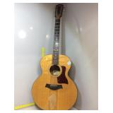 Taylor 6 string acoustic guitar. Sanded down on