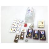 Collection of Olympics pins, cards and more.