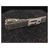 Sterling tie pin with emerald.