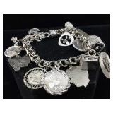 Sterling charm bracelet. Approx 6 in, TW 70.7