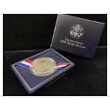 Silver USO coin in box
