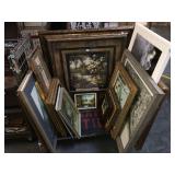 Cart full of assorted framed prints and more