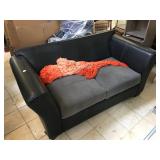 Black love seat, missing back pillows
