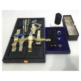 Costume jewelry, watches, pens and display trays.