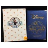 1928 Silver Disney Mickey coin in book