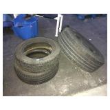 3 assorted tires, one on a rim