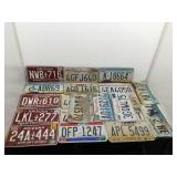 Assorted metal license plates.