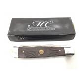 NIB. MC. Masters collection folding knife.