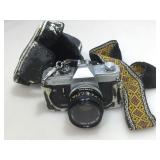 Vintage canon camera in case.