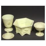 Assorted signed custard glass pieces.
