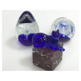 Paperweights. Round, egg, square and cat.