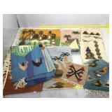 Assorted woven tapestries.