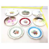 Assorted collectible plates.