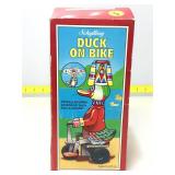 Schylling propeller duck on bike in original box.