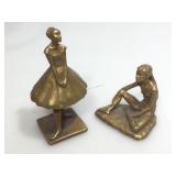 Pair of MCM female statues stamped Fred Press.