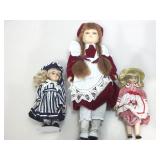 Assorted collectible dolls.