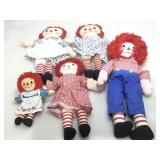 Assorted Raggedy Ann and Andy dolls.