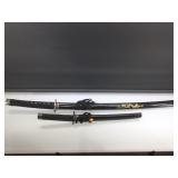 2 piece decorative swords in sheath.