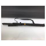 Pair of black knives in sheath.