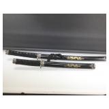 Pair of decorative swords in sheath.