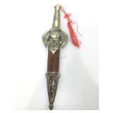 Ornate eagle theme knife in sheath.