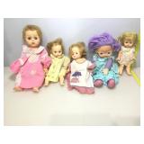 Assorted sleepy eye dolls and more.