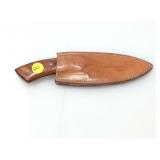 Wood handle Knife in sheath.