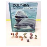 Stone dolphin figures with Vintage National
