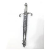 Ornate fantasy knife in sheath.