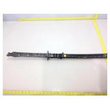 Ornate dragon head sword in sheath.