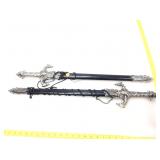 Pair of ornate bejeweled swords In sheath.