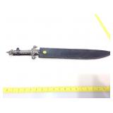 Ornate sword in sheath.