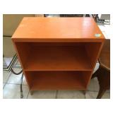 Orange wood bookshelf