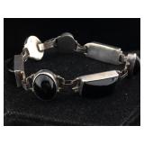Sterling bracelet with black gemstones. 7 in