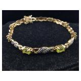Sterling vermeil bracelet peridots. 7 in