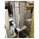 Rotating display rack with one side has a mirror,