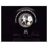2006 999 Silver soccer coin with holder