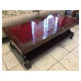 Solid wood ornate rolling coffee table, approx
