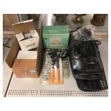 Assorted tools and electronics. Keyboards,