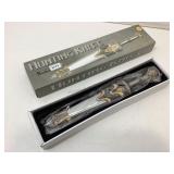 NIB ornate hunting knife.