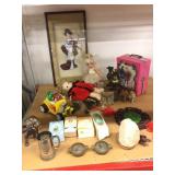Assorted collectible dolls and decor.