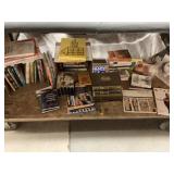 Assorted books and more. Table bottom. Assorted books and more. Table bottom.