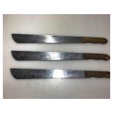 3 New 21in wood handled machete knives. 3 New 21in wood handled machete knives.