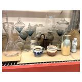 Assorted glassware and home decor items. Assorted glassware and home decor items.