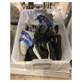 Bin of assorted shoes. Bin of assorted shoes.