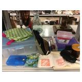Assorted craft stores bins, aprons and more. Assorted craft stores bins, aprons and more.